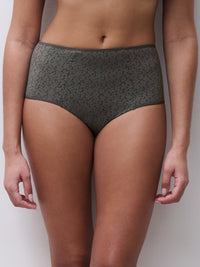 Person wearing a patterned gray underwear on a plain background