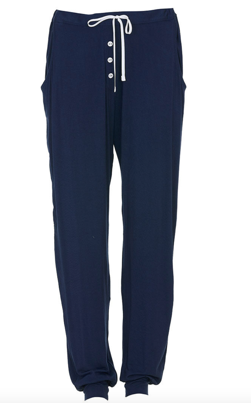 Navy blue jogger pants with white drawstring on a white background