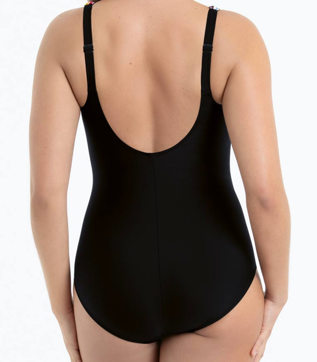 Black swimsuit with open back on a white background