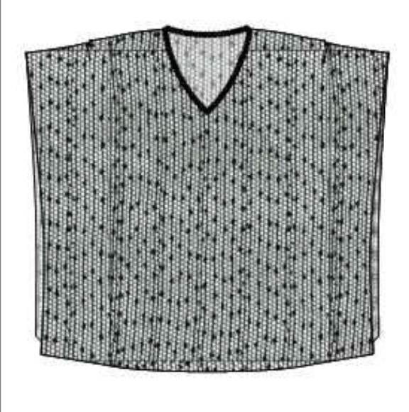 Black and white patterned poncho on a white background
