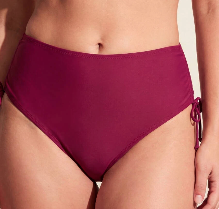 Maroon bikini bottom on a neutral background