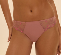 Pink lace underwear on a beige background