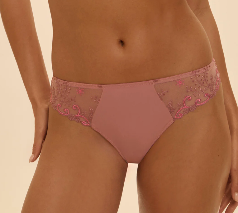 Pink lace underwear on a beige background