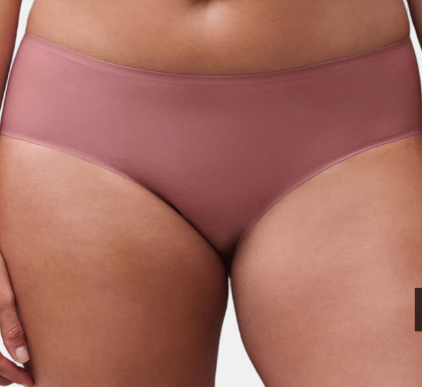 Mauve underwear worn by a person on a neutral background