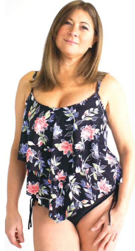 Woman wearing a floral tank top with a white background