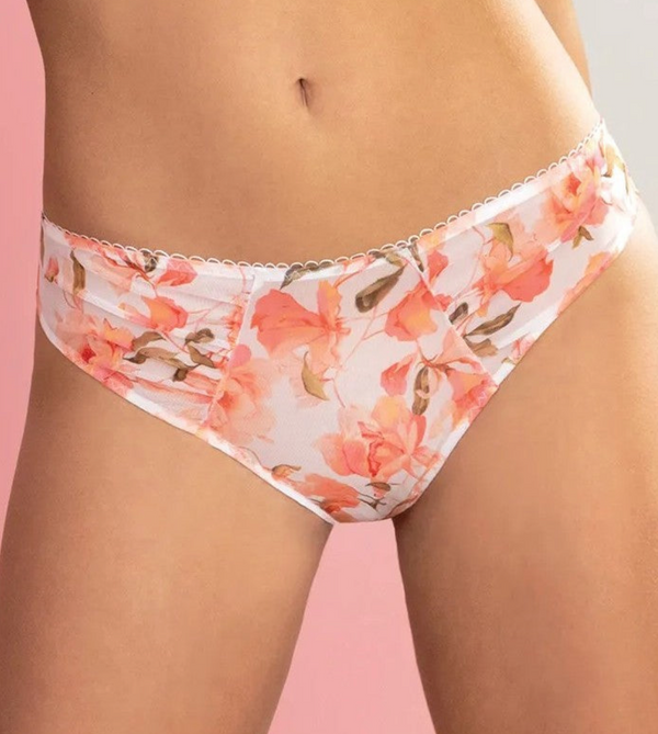 Floral-patterned underwear on a model against a pink background