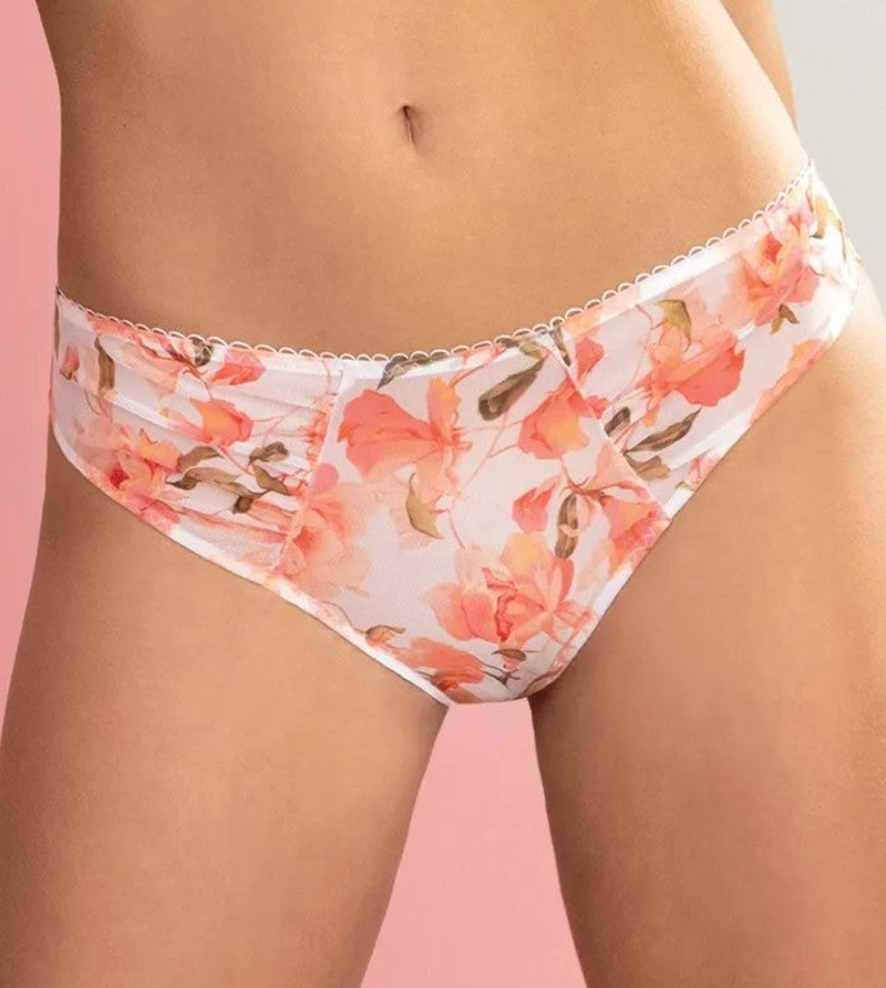 Floral-patterned underwear on a model against a pink background