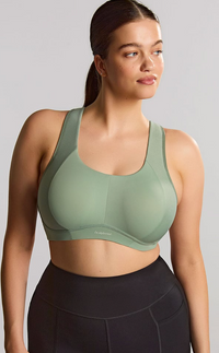 Woman is wearing a pale green sports bras. 