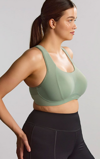 Woman is wearing a pale green sports bras. 