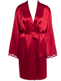 A red silk robe with a tie waist belt and delicate lace trim on the cuffs, displayed on a headless mannequin against a plain white background.