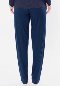 Navy blue pants worn by a person on a white background