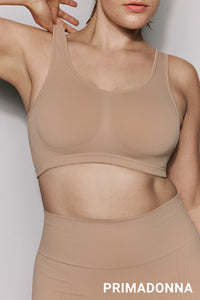 Beige wireless bra and short set with 'Primadonna' branding on a light gray background