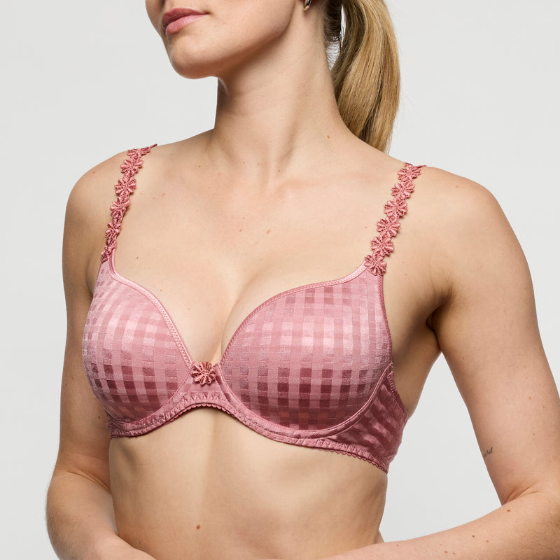 Pink checkered bra with floral lace trim worn by a model on a plain background