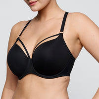 Black bra worn by a model on a plain background