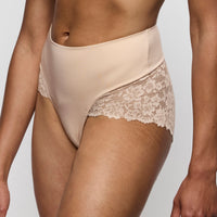 Beige lace-trimmed underwear on a plain background