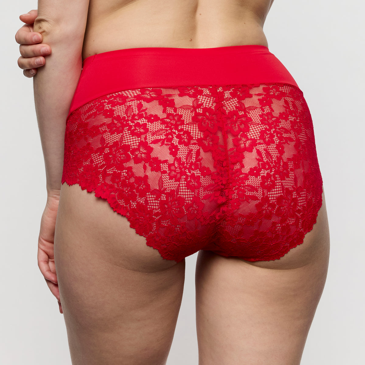 Red lace underwear on a plain background