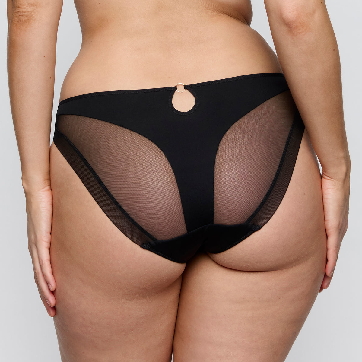 Black sheer underwear on a plain background