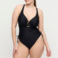 Black swimsuit with a gold buckle on a white background