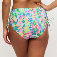 Multicolored tie-dye bikini bottom on a plain background
