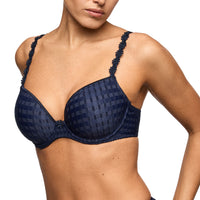 woman wearing a navy bra with sparkles from Marie Jo. 
