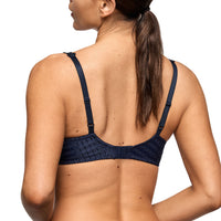woman wearing a navy bra with sparkles from Marie Jo.