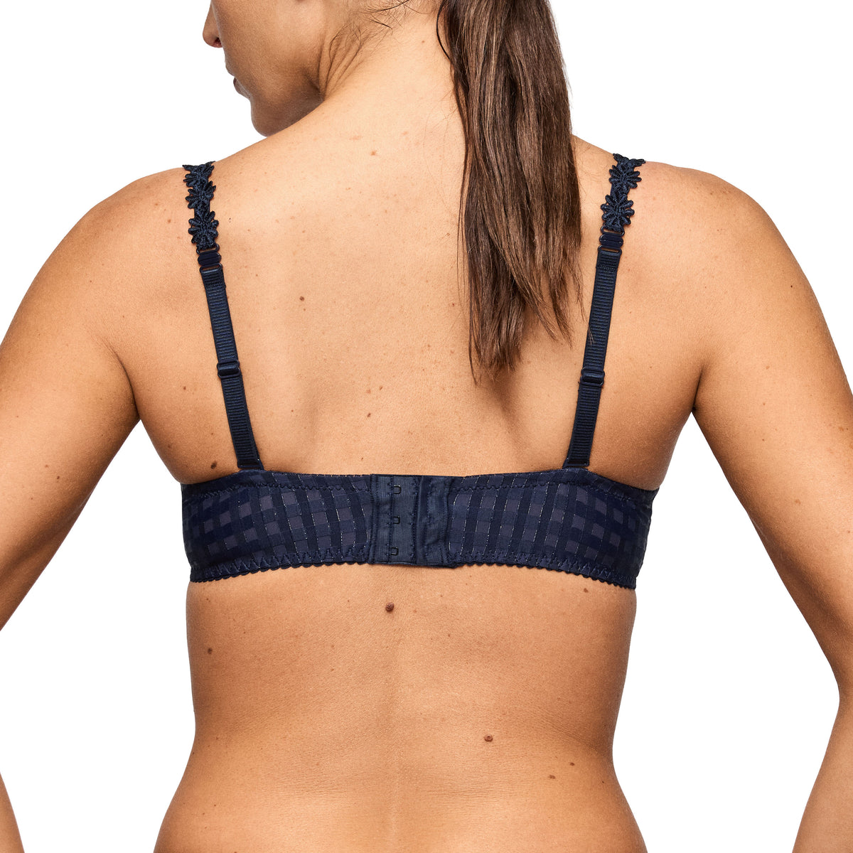 Woman wearing a navy bra from Marie jo. 