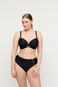 Woman wearing a black bikini on a white background